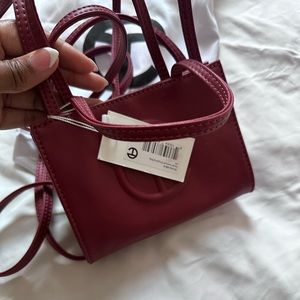 Brand New Teflar Small burgundy bag